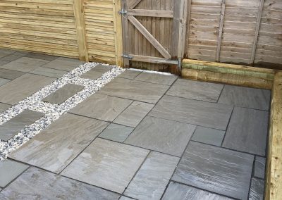 patio tiling by fence