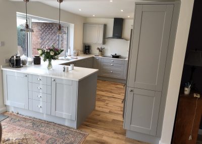 Grey kitchen with warm wood floor