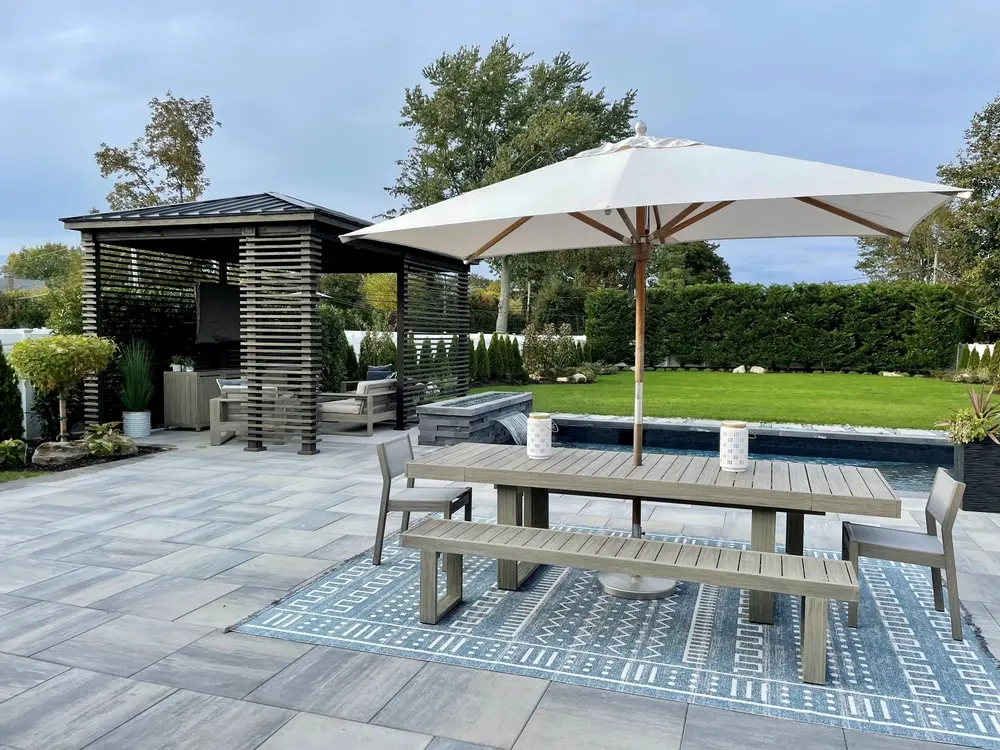 Patio with parasol and bench